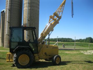 Ford 555c Tractor With Equipment Lifting Boom photo