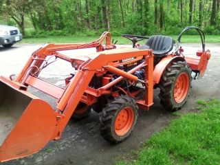Kubota B6000 4x4 Tractor,  Loader,  Case Hydraulic Tiller,  Rear Blade,  Ballast photo