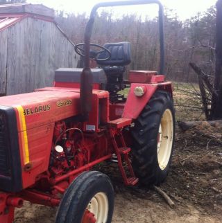 Belarus 250as Tractor.  Runs And Drives Good.  Rear Remote Good Tractor.  Cheap photo