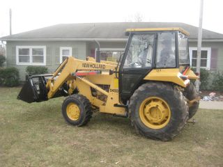 1999 Holland 545d Fwd Tractor Loader,  4in1 Bucket photo
