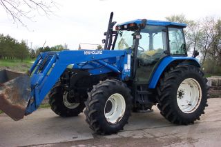 Holland Ts100 Mfwd Tractor With 7511 Loader photo