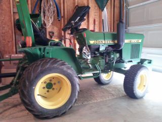John Deere 650 Diesel Tractor With Attachments photo