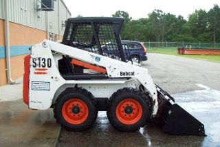 Bobcat S130 Clearing Pkg,  All Bucket,  5 ' Brushcutter,  6 ' Grapple,  Forks &tree Boom photo