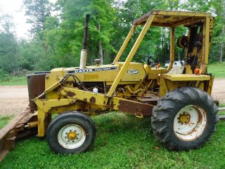 Case 580 Diesel Tractor With Forklift And 6 - Way Front Blade photo