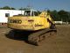 Kobelco Sk210 With Caterpillar S30 Scrap Shear Excavators photo 1