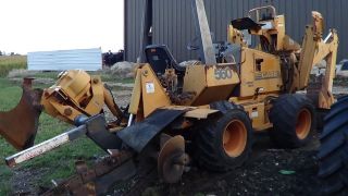 Case 560 Trencher With Plow And Backhoe Attachment photo