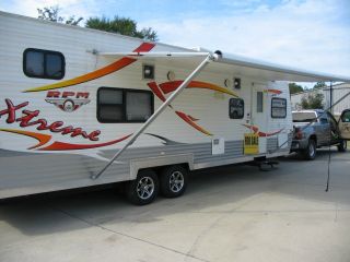 26 ' Rpm Adventure Toy Hauler With Slide Out (camper) photo