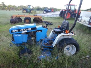 Holland 1215 Compact Tractor With 914 Mower Deck photo