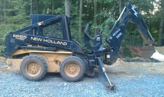 Holland Lx665 Skid Steer With Bucket & Backhoe Attachment photo