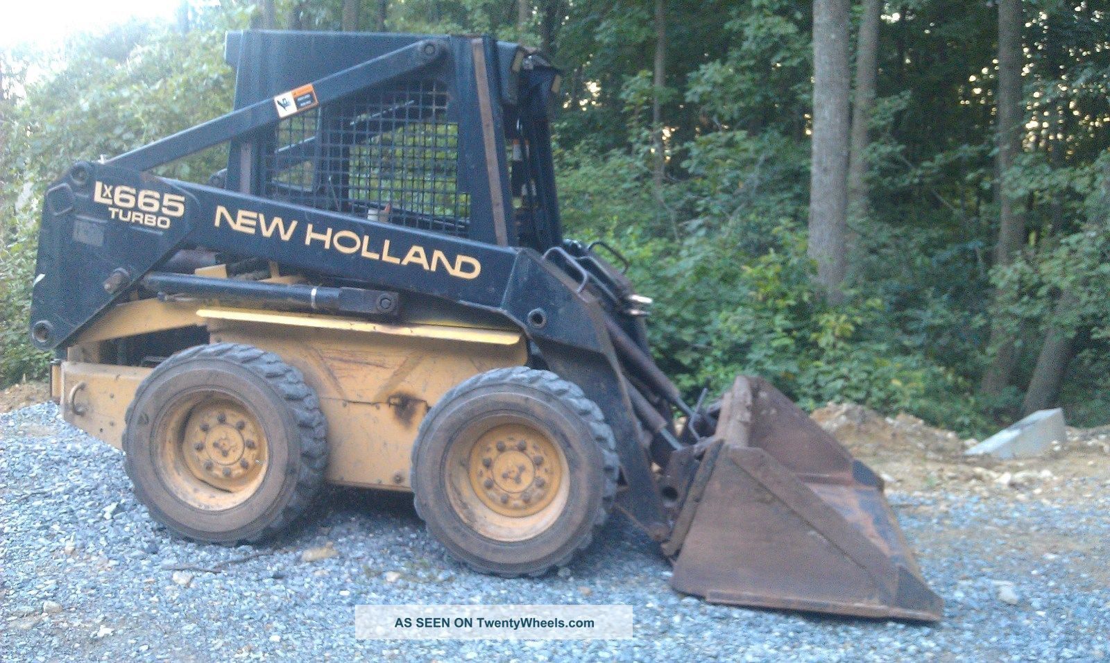 Holland Lx665 Skid Steer With Bucket & Backhoe Attachment