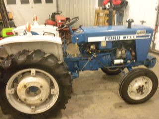Ford 1600 Tractor With 5ft Farm King Snow Blower And 5ft Woods Lawn Mower photo