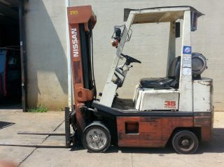Nissan Forklift Starting Bid $2300.  00 photo