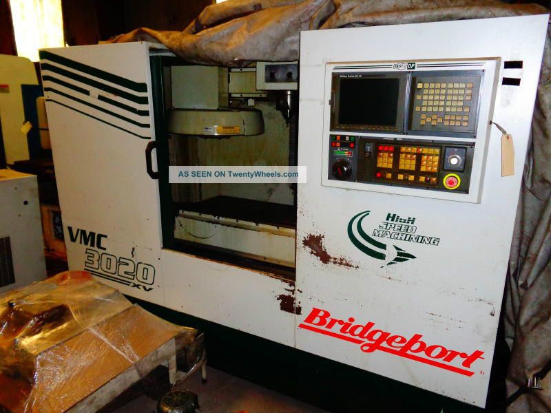 Bridgeport Vmc 3020 Xv (1999) With Ge Fanuc 21i - M & Conveyer Auger Milling Machines photo