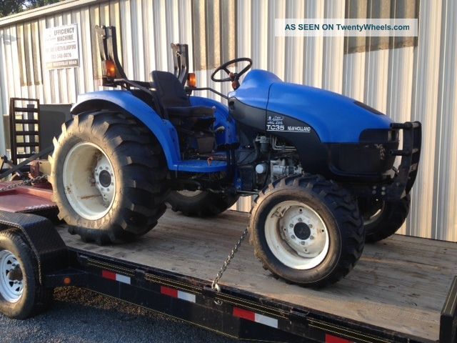 Holland Tc35 4x4 Tractor With Bushog Tractors photo