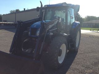 Holland Ts115a Loader Tractor photo