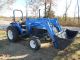 Holland Tn55 Diesel Farm Tractor With Self Leveling Holland 32la Loader Tractors photo 1