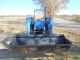 Holland Tn55 Diesel Farm Tractor With Self Leveling Holland 32la Loader Tractors photo 2