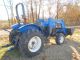 Holland Tn55 Diesel Farm Tractor With Self Leveling Holland 32la Loader Tractors photo 3