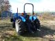 Holland Tn55 Diesel Farm Tractor With Self Leveling Holland 32la Loader Tractors photo 4