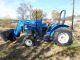 Holland Tn55 Diesel Farm Tractor With Self Leveling Holland 32la Loader Tractors photo 7