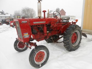 Farmall 140 With Fast Hitch And Rear Blade Tires In Pa photo