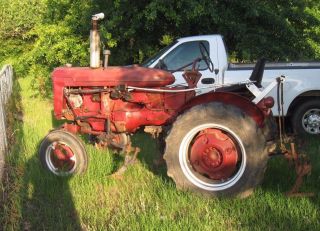 Late 1940s Farmall A Tractor And Accessories - Rebuilt Motor photo