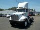 2009 Peterbilt 335 Daycab Semi Trucks photo 1