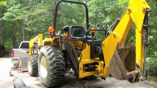 Cub Cadet Compact Tractor Model 7265 With Front Loader And Backhoe Tlb 4x4 4wd photo
