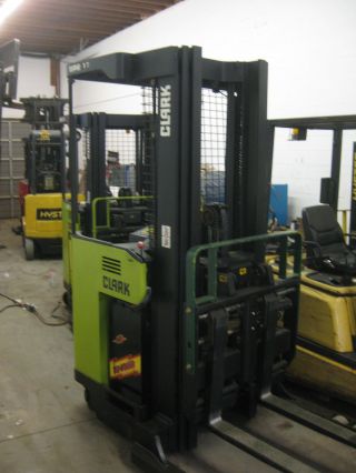 Clark Narrow Aisle Electric Reach Forklift - - Battery & Charger Inc photo